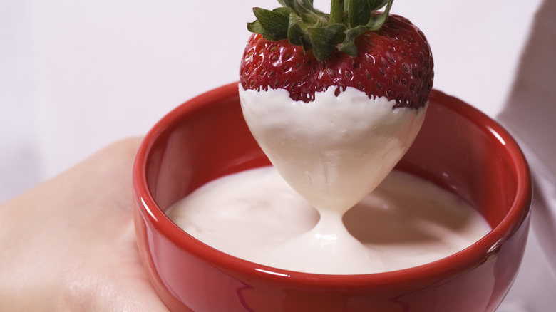 strawberry dipped into melted almond bark