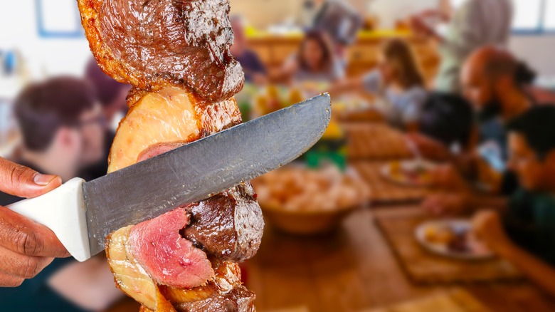 Slicing meat at steakhouse