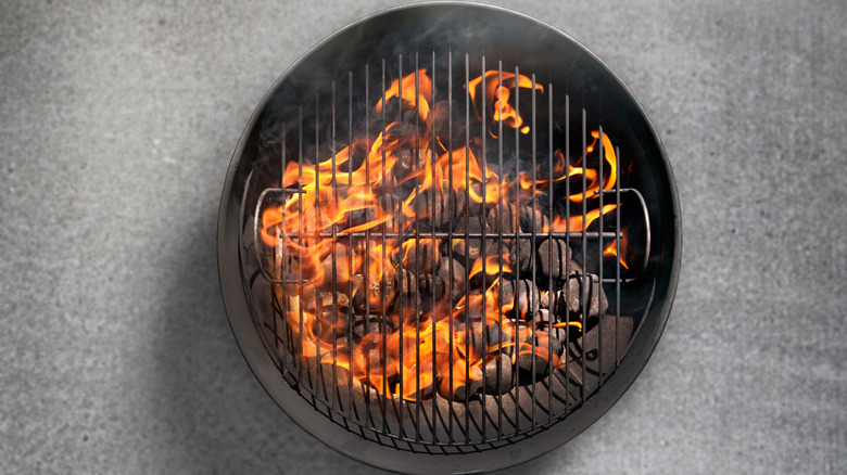 Charcoal barbecue on a concrete patio