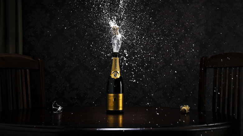 Champagne bottle bursting