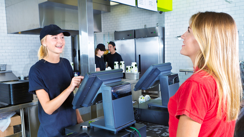 Woman ordering at a fast food restaurant