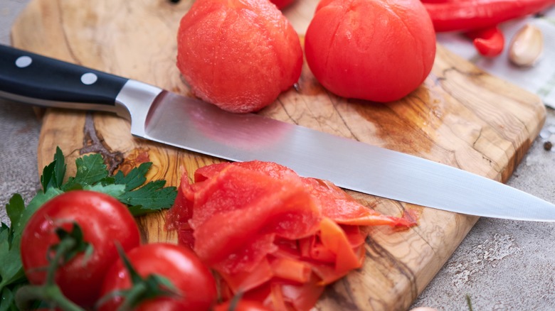 Tomato peels of wooden board