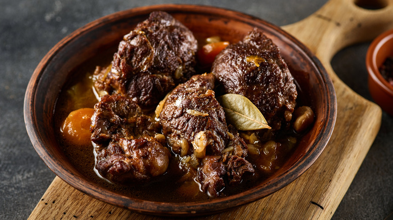 Stewed pork cheeks in a rustic bowl