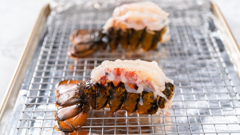 Raw lobster tails on rack