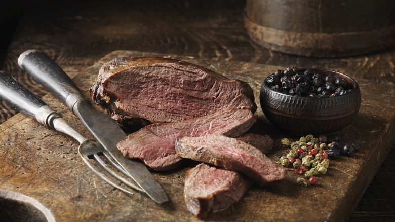 venison steak on a cutting board