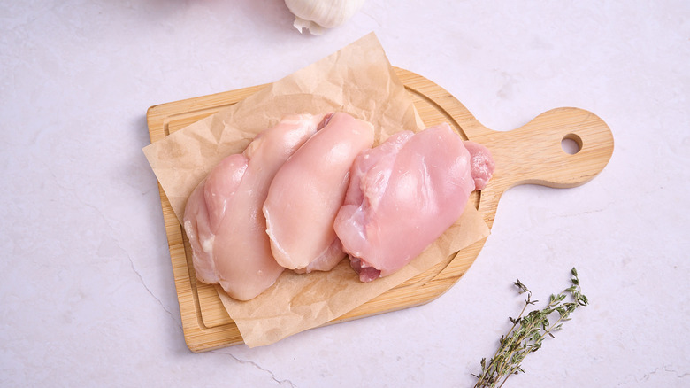 Chicken thighs on a cutting board