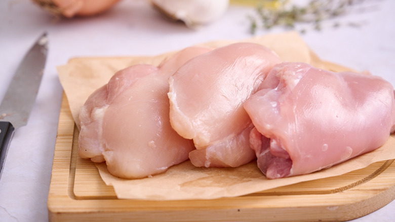 Chicken thighs on a cutting board