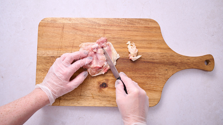 Slicing chicken along the bone