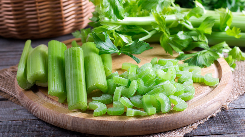 cut frozen celery on a cutting board