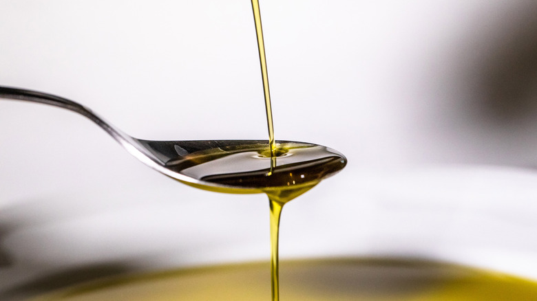 Cooking oil poured onto a spoon