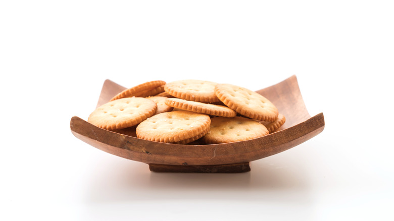 Plain crackers on wood tray