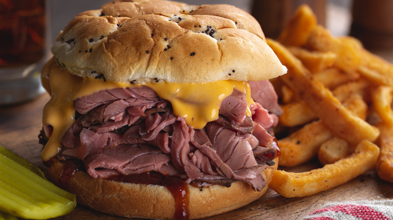 Roast beef and cheddar sandwich on onion roll