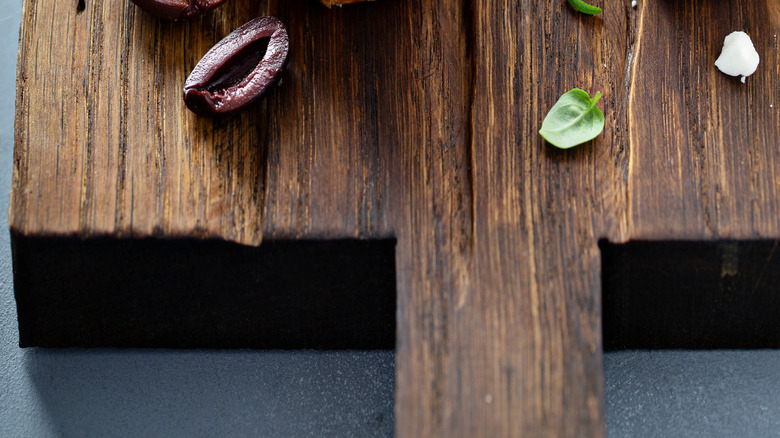 Steak crostini with cheese, basil, and olives