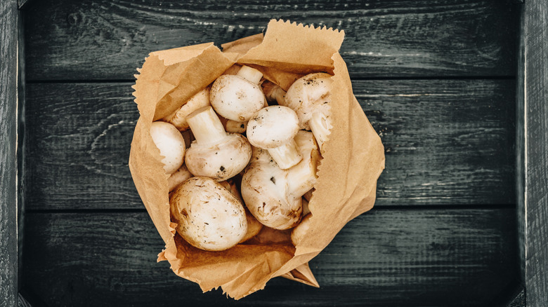 mushrooms in brown paper bag