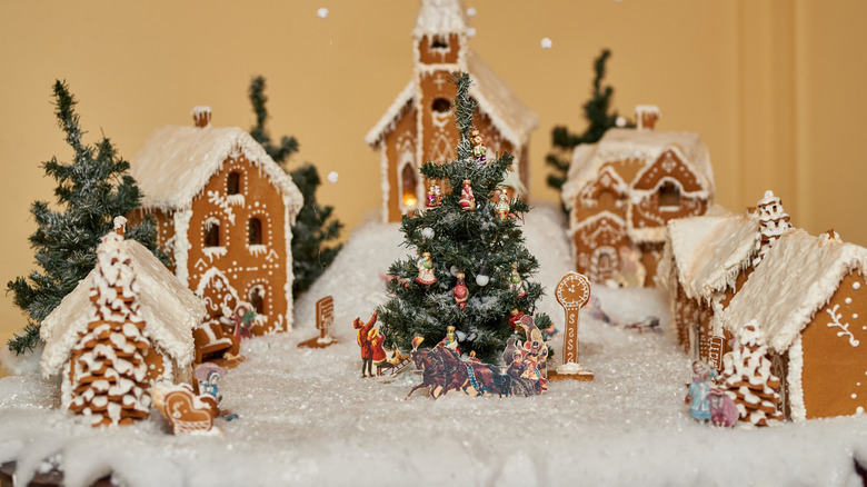 Decorated gingerbread village with glittery snow