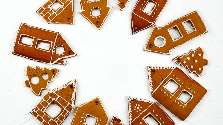 Pieces of a gingerbread house, decorated and ready to assemble