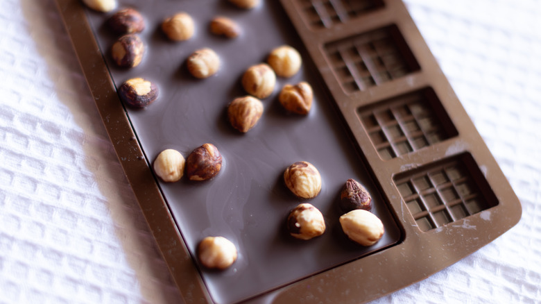 Homemade chcocolate with hazelnuts in a silicone mold