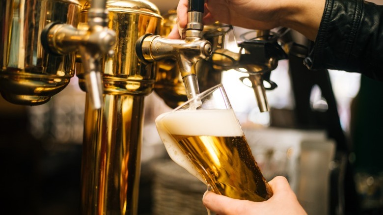 Bartender pouring beer from the tap