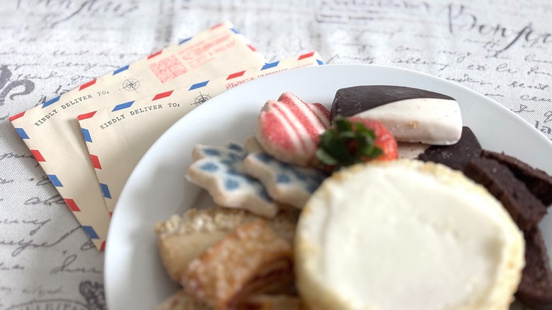 airmail letters next to dessert plate on table