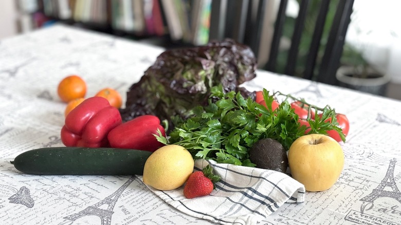 arrangement of fresh produce on a Parisian tablecloth