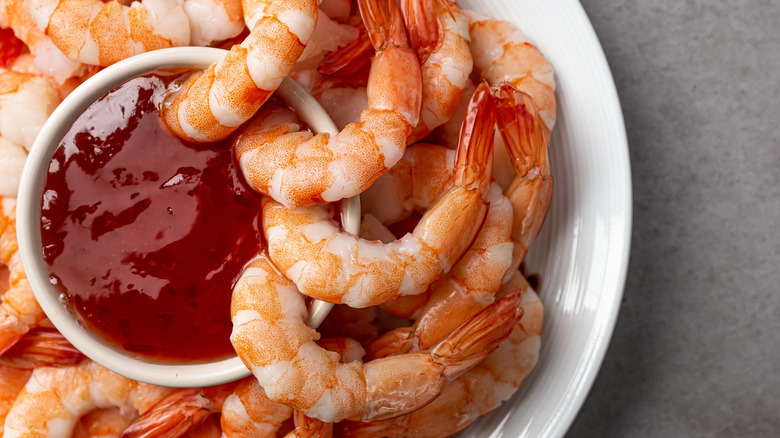 Shrimp on a platter with cocktail sauce