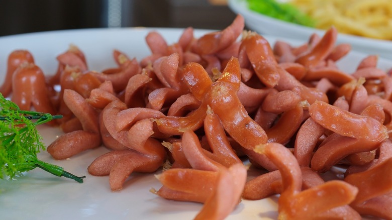 A platter of small hot dogs cut into octopuses