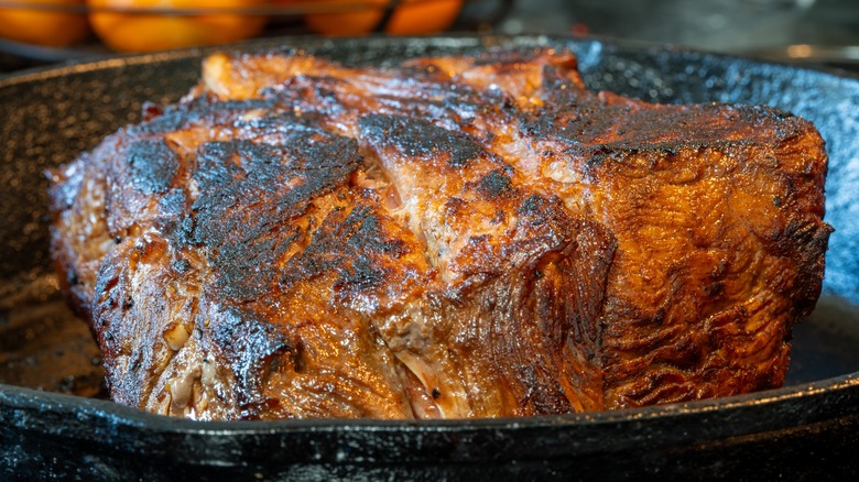 Beef roast searing in skillet