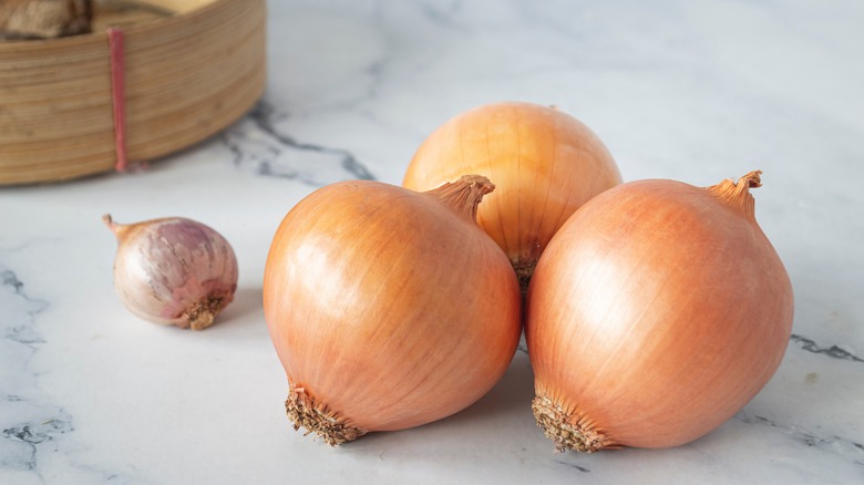 yellow onions on a counter