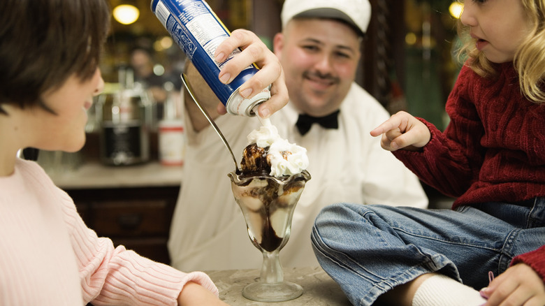 Man serving an ice cream sundae