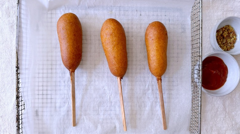 corn dogs in metal tray