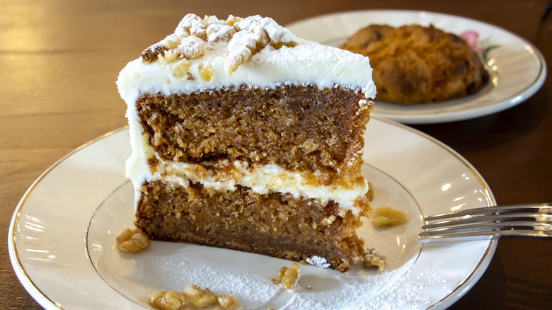 Slice of plated carrot cake with fork