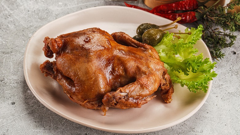 Roast chicken on white plate