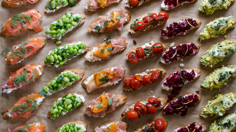 Different types of crostini on parchment paper