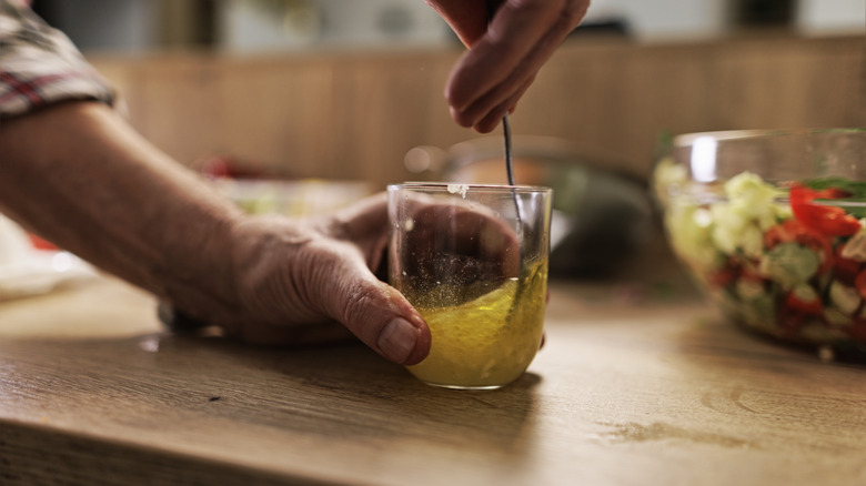 Mixing vinaigrette in a cup