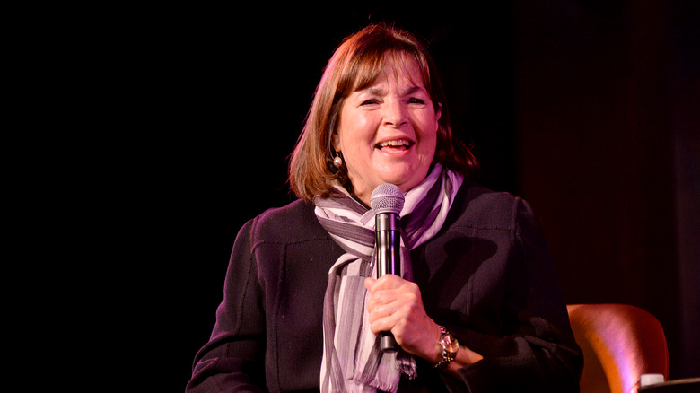 Ina Garten on stage holding a microphone