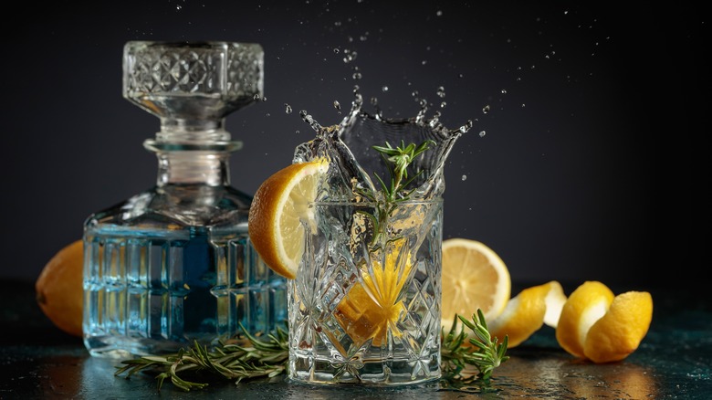 Tonic cocktail splashing citrus background