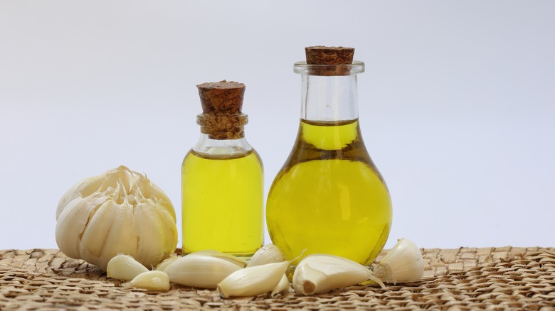 Olive oil bottles and garlic