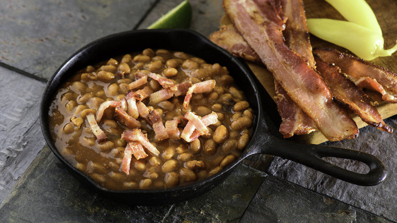 Cast iron pan of beans and bacon