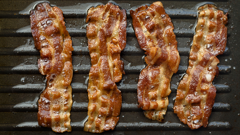 cooking bacon on pan