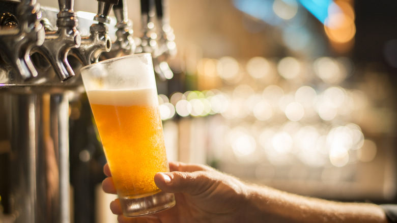 pouring beer from tap