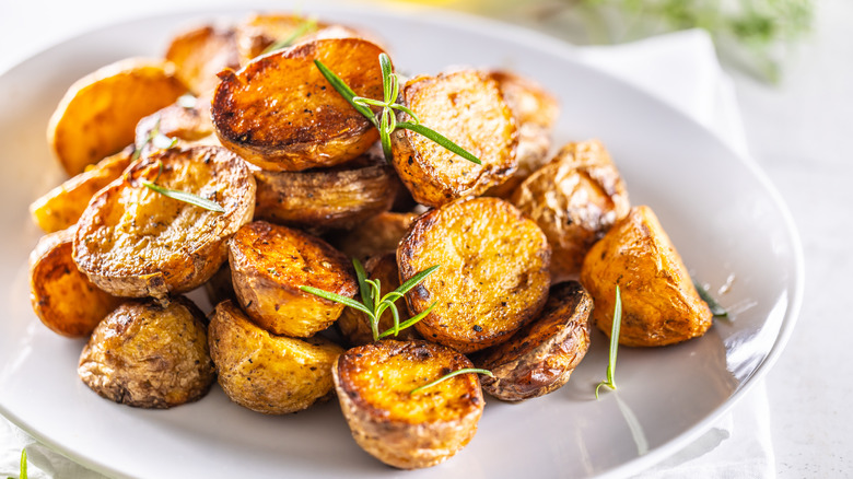 roasted potato rounds on a white plate