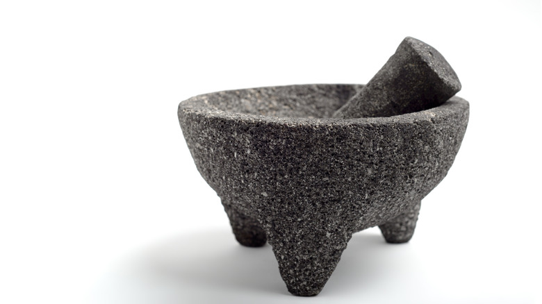 black molcajete against white background