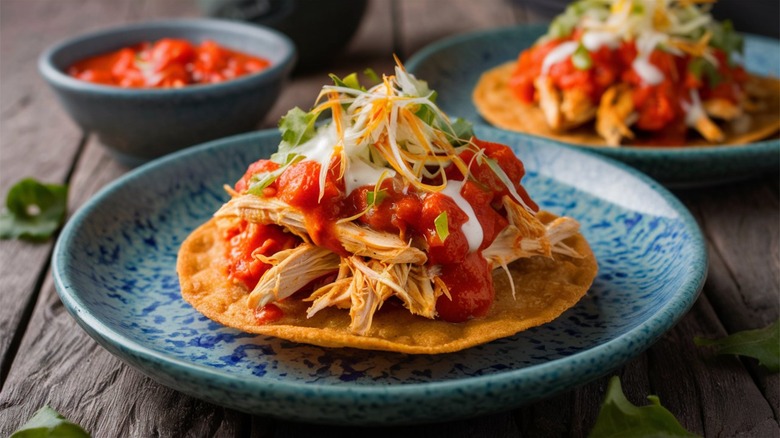 Chicken tinga tostada on plate