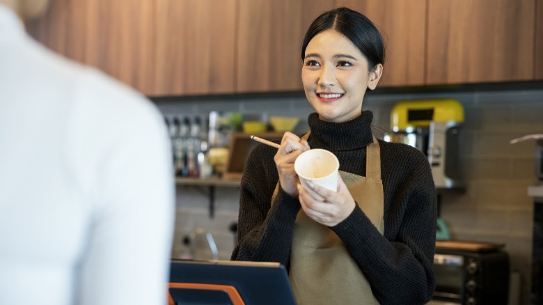 Barista taking a coffee order