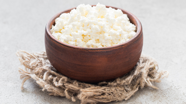 Wooden bowl of cottage cheese