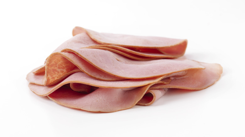 Sliced ham on a white background.
