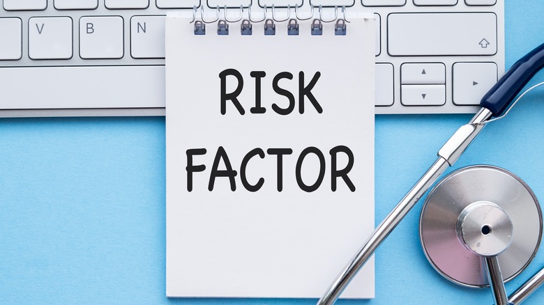 "Risk factor" written on notepad