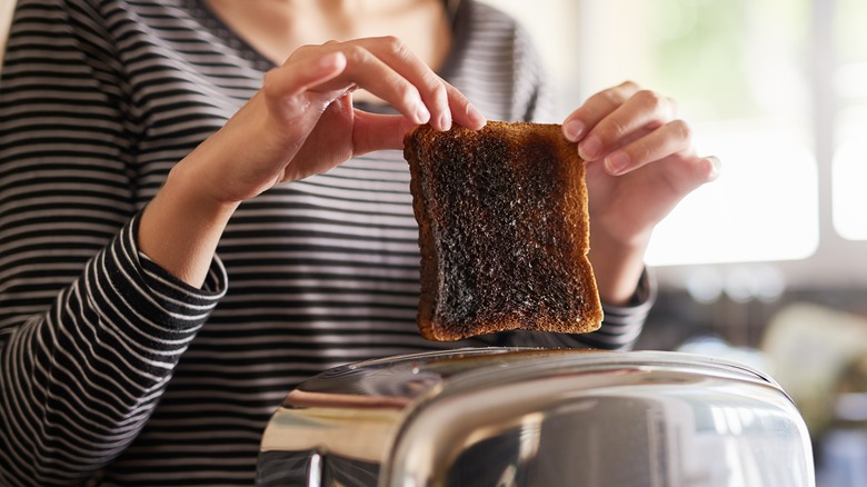 removing burnt toast from toaster