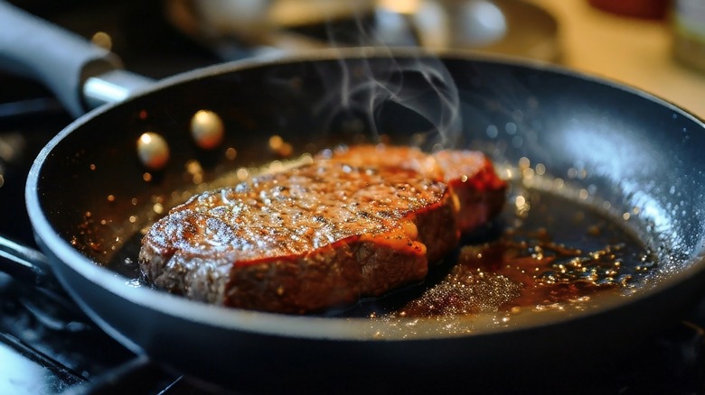 Searing steak in a pan