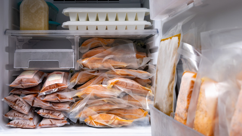 Frozen salmon stacked in freezer